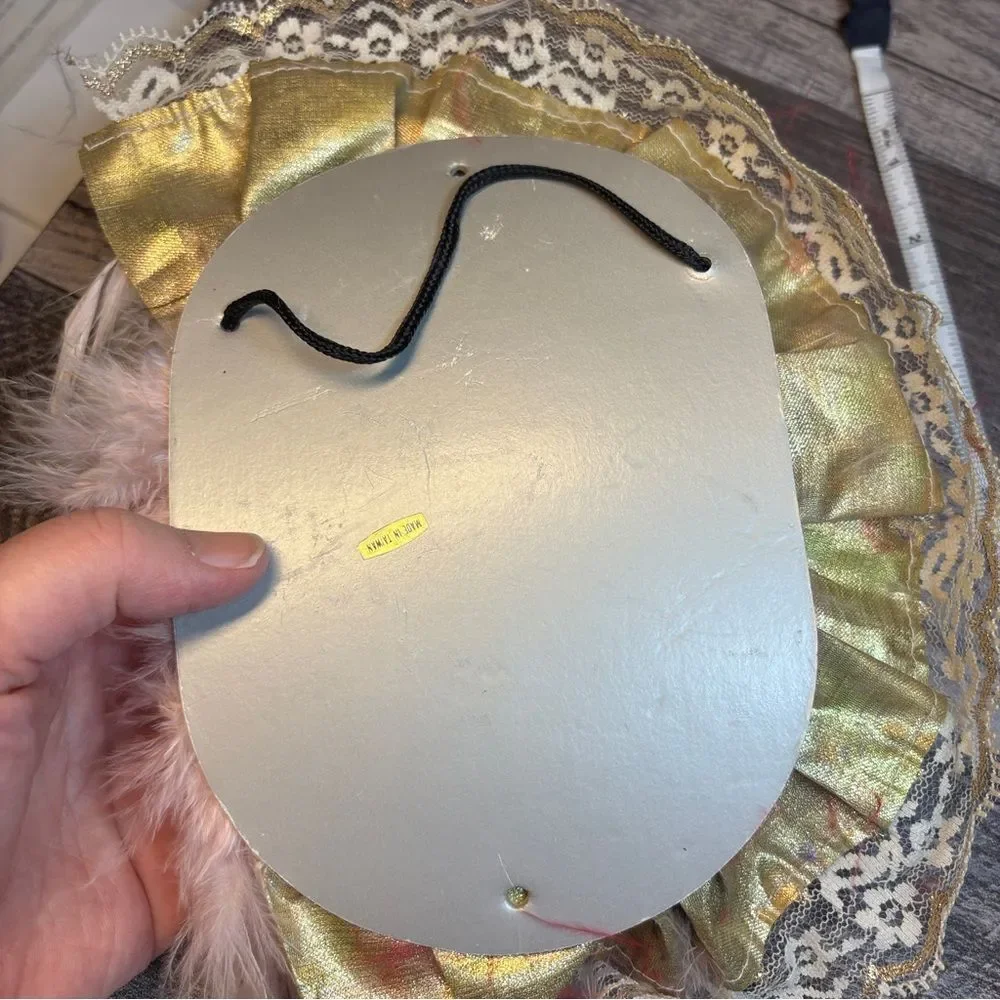 Elegant Feathered Mask with Gold and Pink Accents